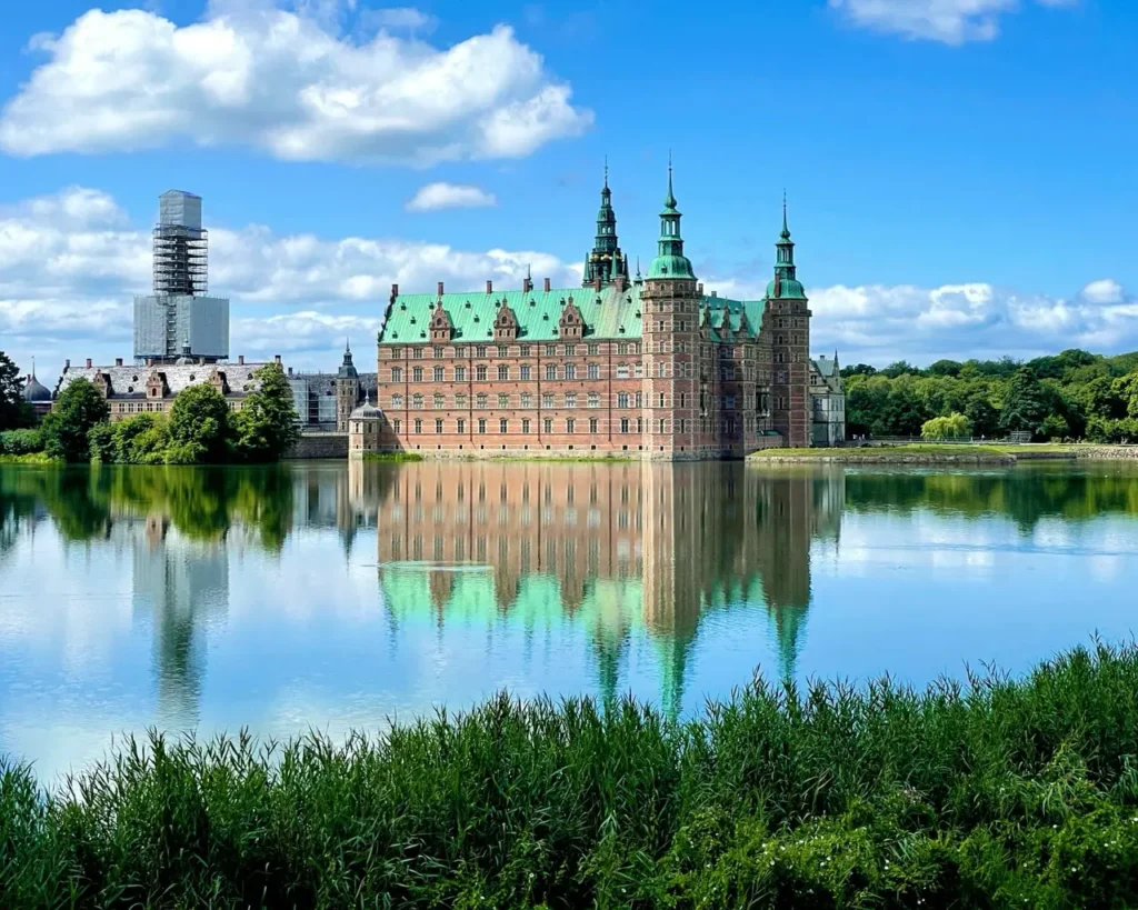 Frederiksborg castle reflecting on water - one of the best day trips from Copenhagen