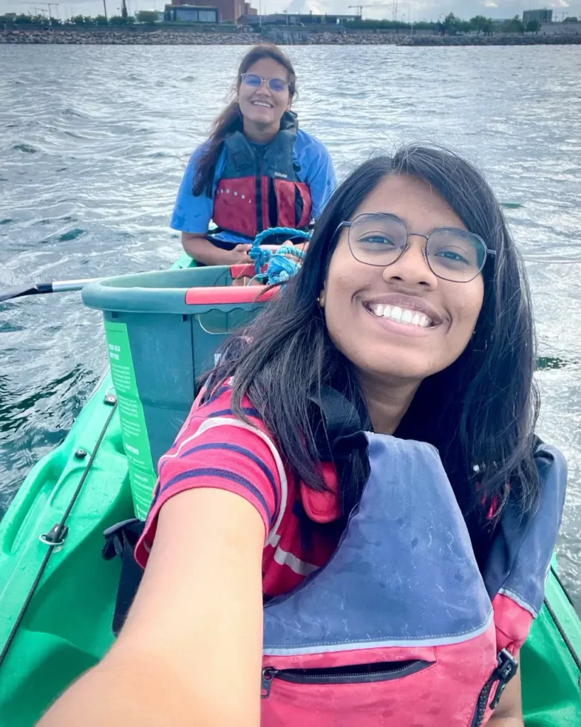 Agalya and her friend kayaking with Green Kayak