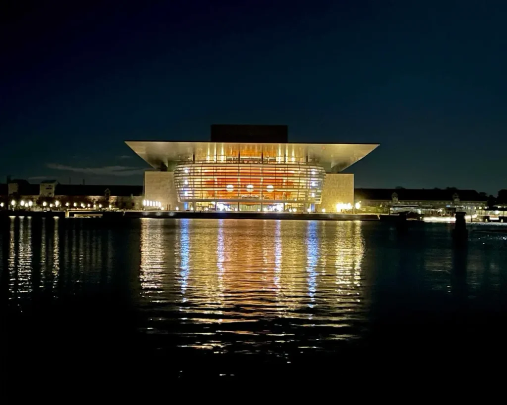 Copenhagen Opera House at night reflecting on the water