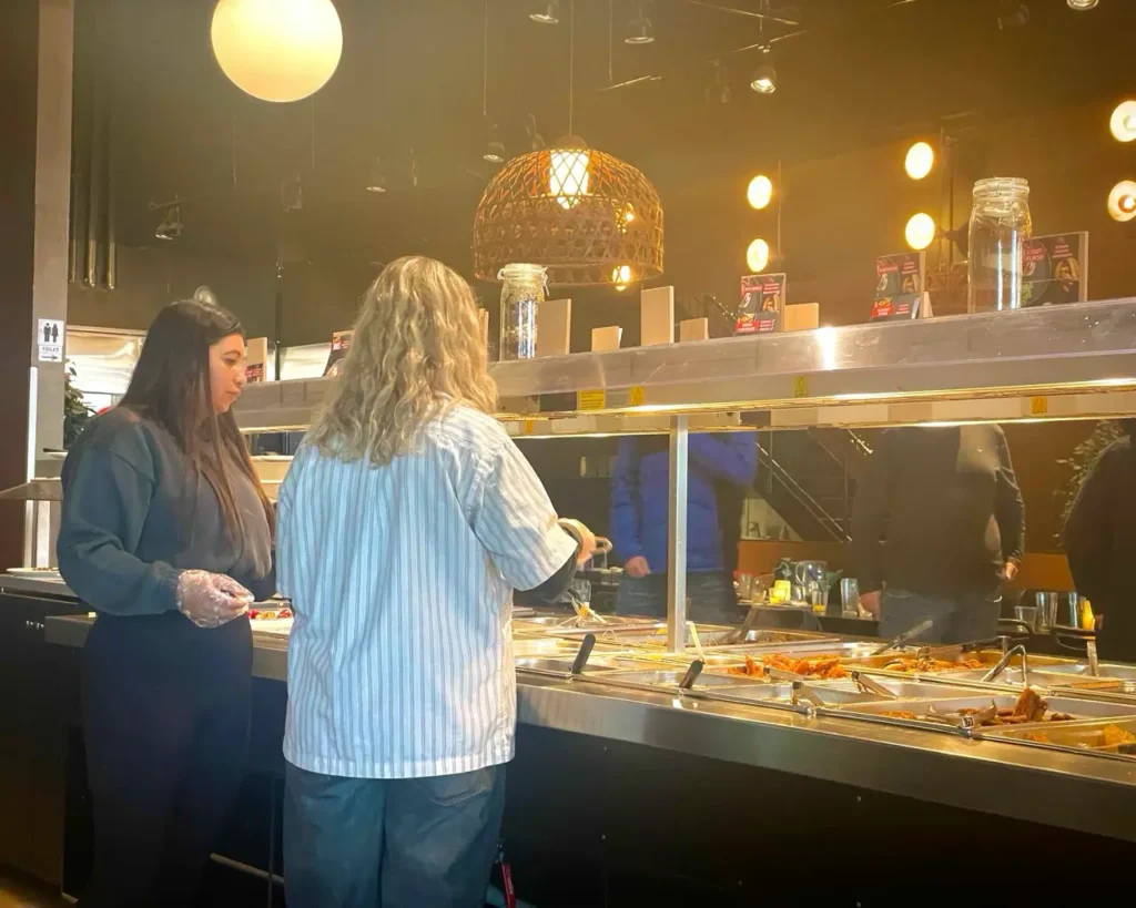 People getting food from Dalle Valle - cheap buffet restaurant in Copenhagen
