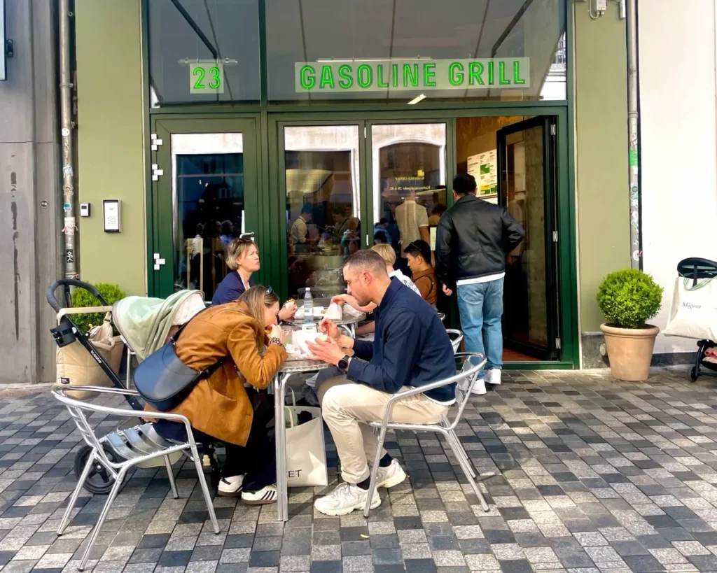 people eating in front of Gasoline Grill - best burger shop in Copenhagen