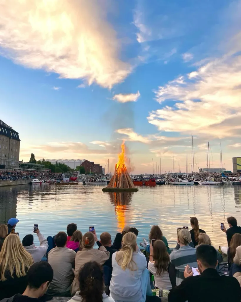 People watching the Sankt Hans Aften midsummer festival celebrations in Copenhagen